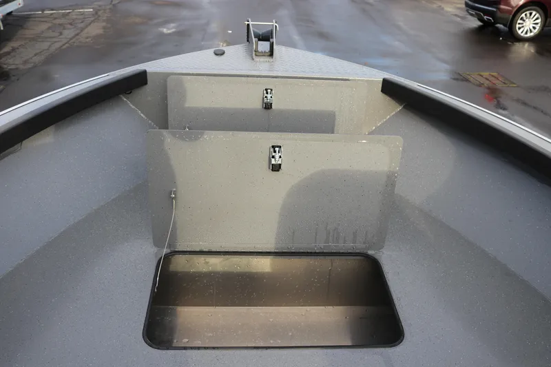 Slide: The Image of 2026 Alumaweld Adventurer 18 boat interior with storage compartments. - 10