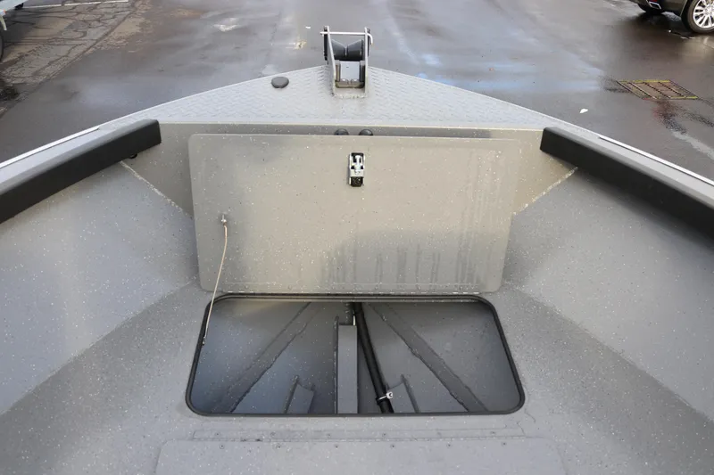 Slide: The Image of 2026 Alumaweld Adventurer 18 boat interior, featuring storage compartment and sleek design. - 11