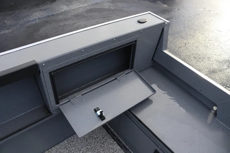 Slide: The Image of 2026 Alumaweld Adventurer 18 boat interior with open storage compartment. - 13