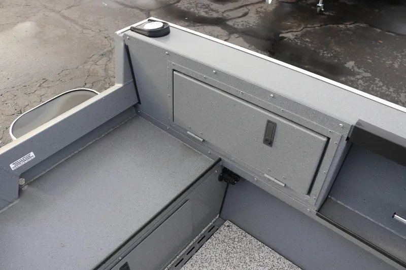 Slide: The Image of 2026 Alumaweld Adventurer 18 boat interior, featuring storage compartment and sleek gray finish. - 15
