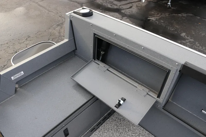 Slide: The Image of 2026 Alumaweld Adventurer 18 boat interior with open storage compartment. - 16