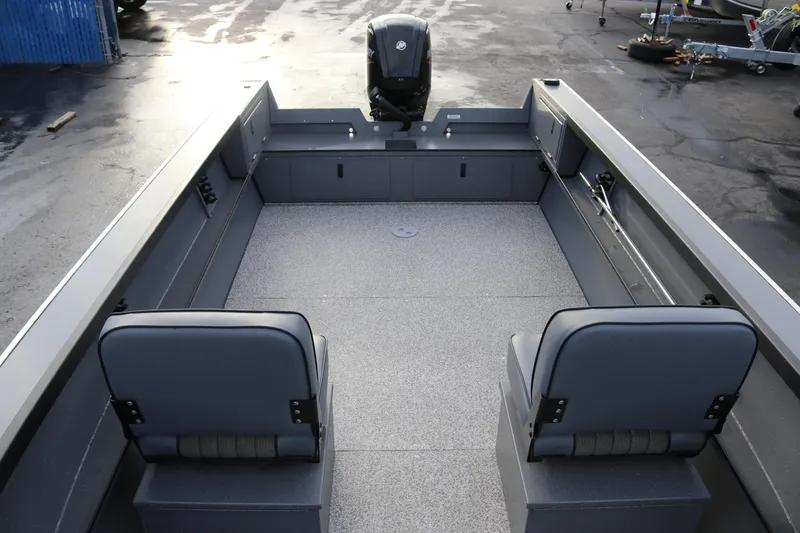 Slide: The Image of 2026 Alumaweld Adventurer 18 boat interior with two seats and spacious deck. - 4