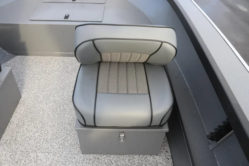 Slide: The Image of 2026 Alumaweld Adventurer 18 boat seat with gray upholstery and storage compartment. - 5