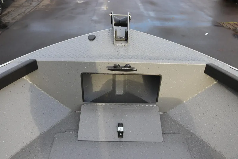 Slide: The Image of 2026 Alumaweld Adventurer 18 boat bow with storage compartment and diamond plate deck. - 9