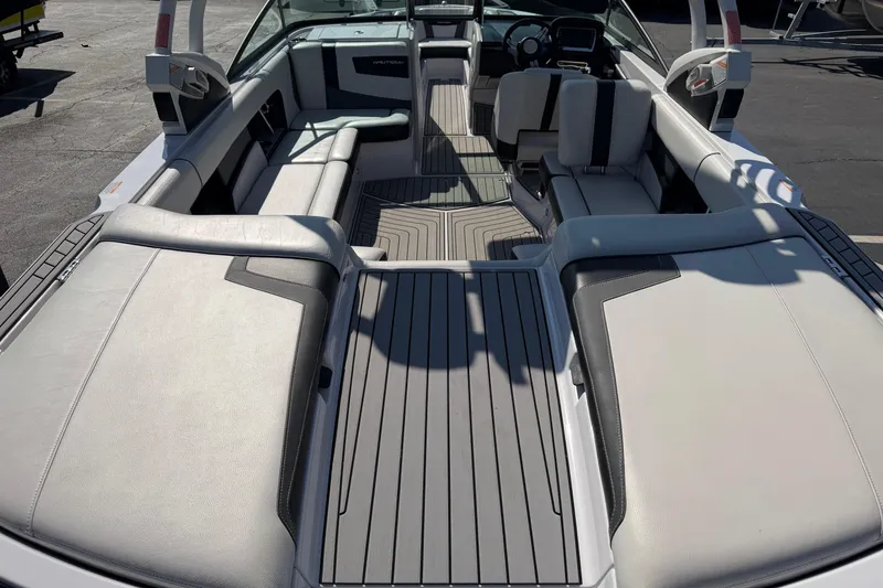 Slide: The Image of 2015 Nautique Super Air Nautique 230 interior with sleek seating and modern design. - 5
