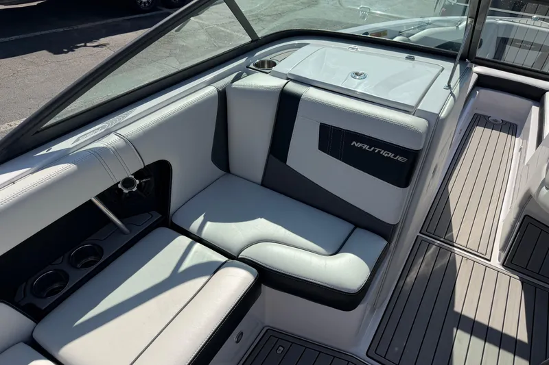 Slide: The Image of 2015 Nautique Super Air Nautique 230 interior with sleek seating and modern design. - 6