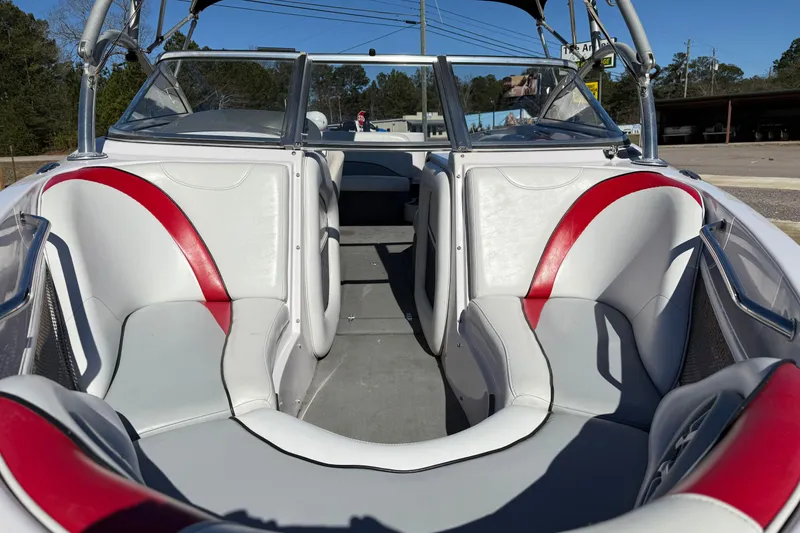 Slide: The Image of 2004 Nautique Air Nautique 226 boat interior with white and red seating. - 18