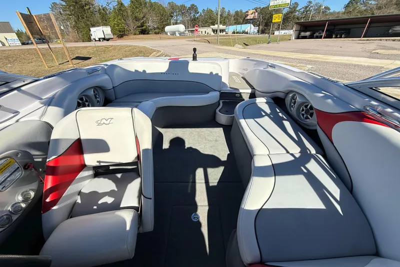Slide: The Image of 2004 Nautique Air Nautique 226 boat interior with white and red seating. - 19