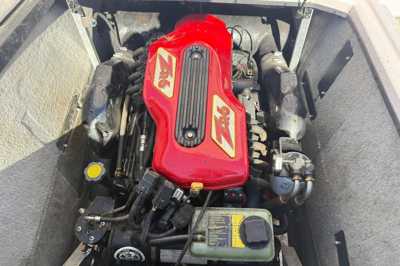 Slide: The Image of 2004 Nautique Air Nautique 226 engine with red ZR6 cover, detailed view. - 20
