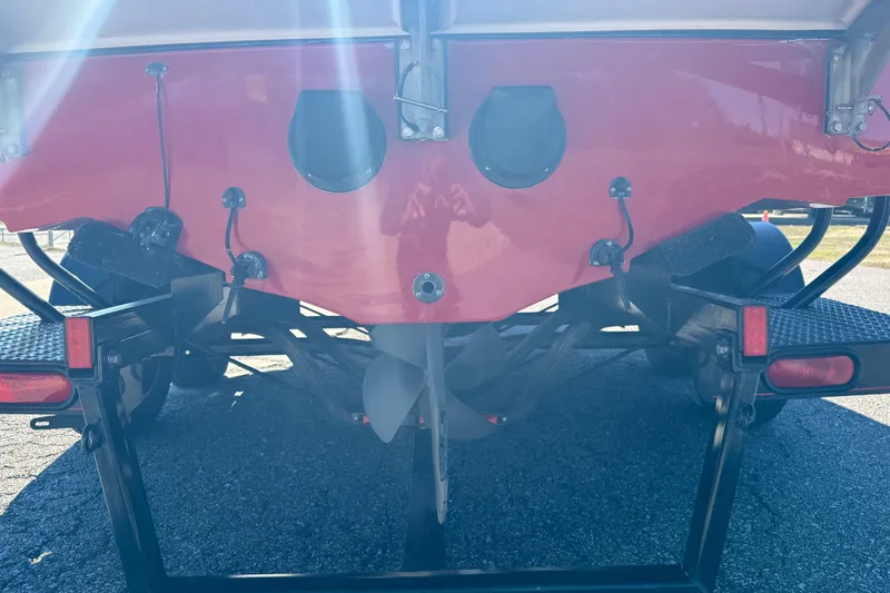 Slide: The Image of Rear view of a 2004 Nautique Air Nautique 226 boat on a trailer. - 21