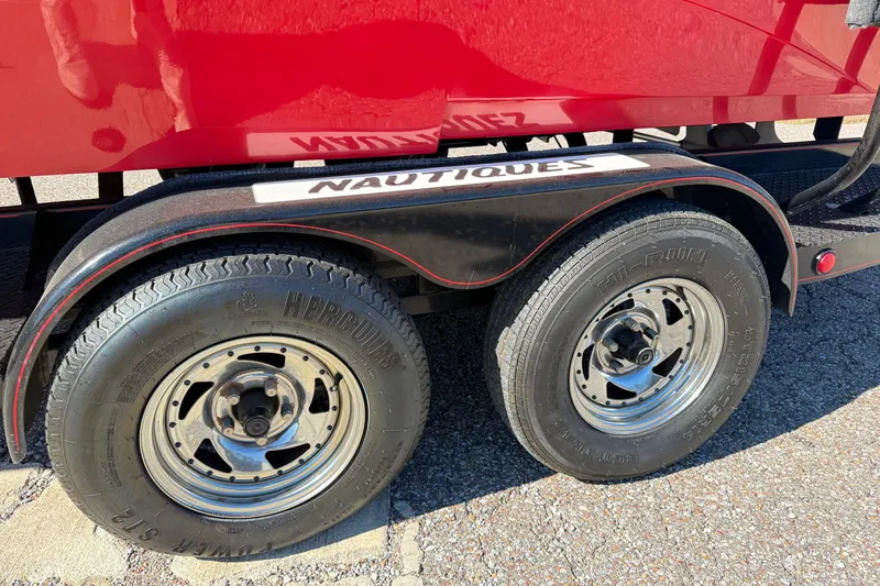 Slide: The Image of Trailer wheels of a 2004 Nautique Air Nautique 226 boat, featuring Hercules tires. - 22