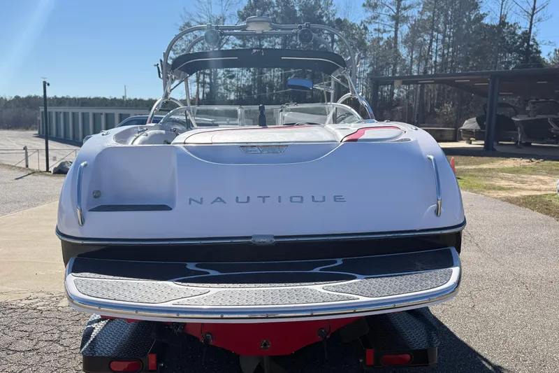 Slide: The Image of 2004 Nautique Air Nautique 226 boat, rear view, parked outdoors on a sunny day. - 6