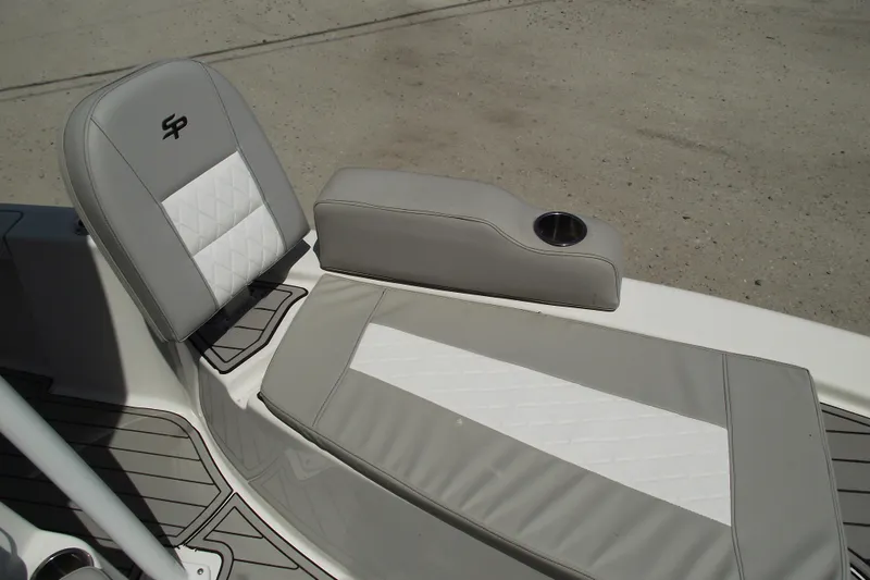 Slide: The Image of 2019 Sea Pro 208 Bay boat interior with cushioned seating and cup holder. - 10