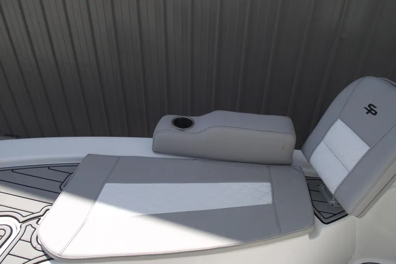 Slide: The Image of 2019 Sea Pro 208 Bay boat seat with cup holder, featuring gray and white upholstery. - 11