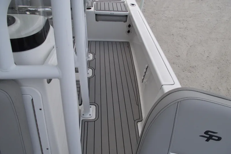 Slide: The Image of 2019 Sea Pro 208 Bay boat interior with sleek gray flooring and seating. - 18