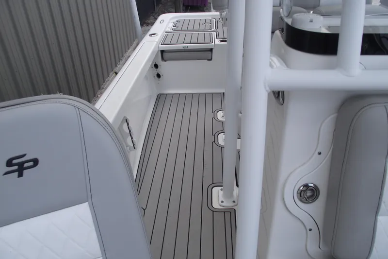 Slide: The Image of 2019 Sea Pro 208 Bay boat interior with gray deck and seating. - 19
