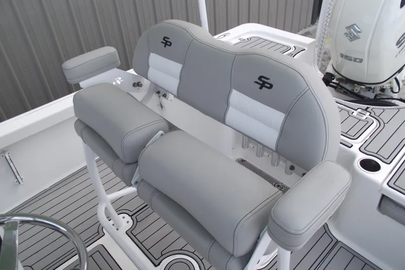 Slide: The Image of 2019 Sea Pro 208 Bay boat interior with gray seating and Suzuki 150 engine. - 20