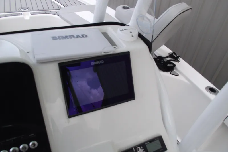 Slide: The Image of Simrad display on 2019 Sea Pro 208 Bay boat dashboard. - 23