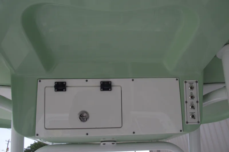 Slide: The Image of 2019 Sea Pro 208 Bay boat console with storage compartment and control panel. - 24