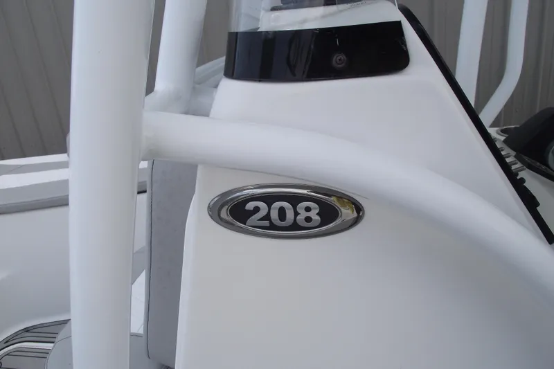 Slide: The Image of 2019 Sea Pro 208 Bay boat emblem on white surface. - 26