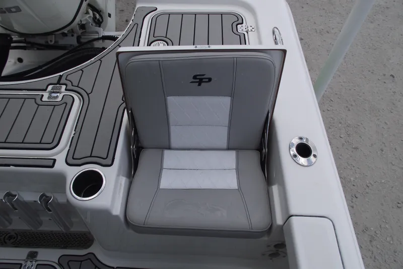 Slide: The Image of 2019 Sea Pro 208 Bay boat seat with gray and white upholstery, featuring cup holders. - 29