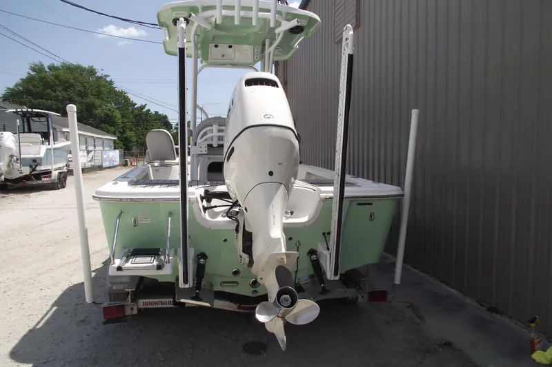 Slide: The Image of 2019 Sea Pro 208 Bay boat with outboard motor, parked on a trailer. - 3
