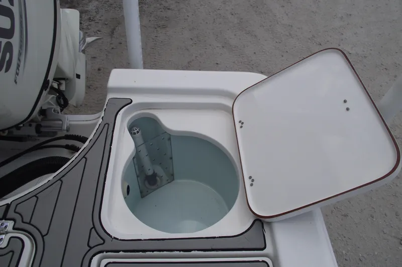 Slide: The Image of Open storage compartment on a 2019 Sea Pro 208 Bay boat, showing interior details. - 31