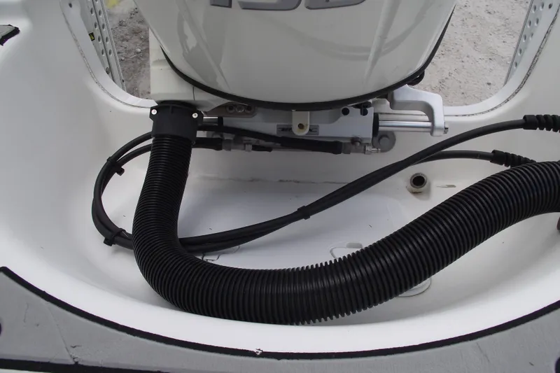 Slide: The Image of 2019 Sea Pro 208 Bay boat engine compartment with hoses and wiring. - 32
