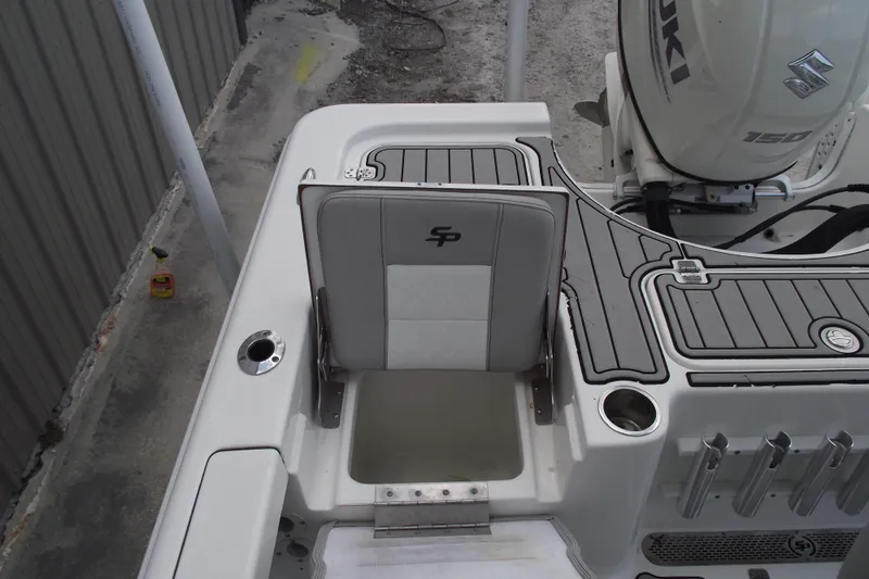 Slide: The Image of 2019 Sea Pro 208 Bay boat with Suzuki 150 engine, featuring seating and storage area. - 35