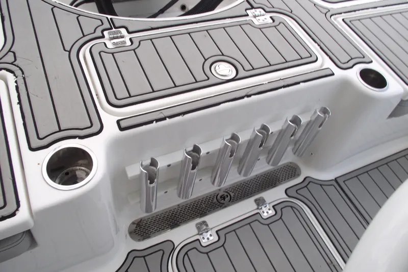 Slide: The Image of 2019 Sea Pro 208 Bay boat deck with rod holders and cup holders. - 36