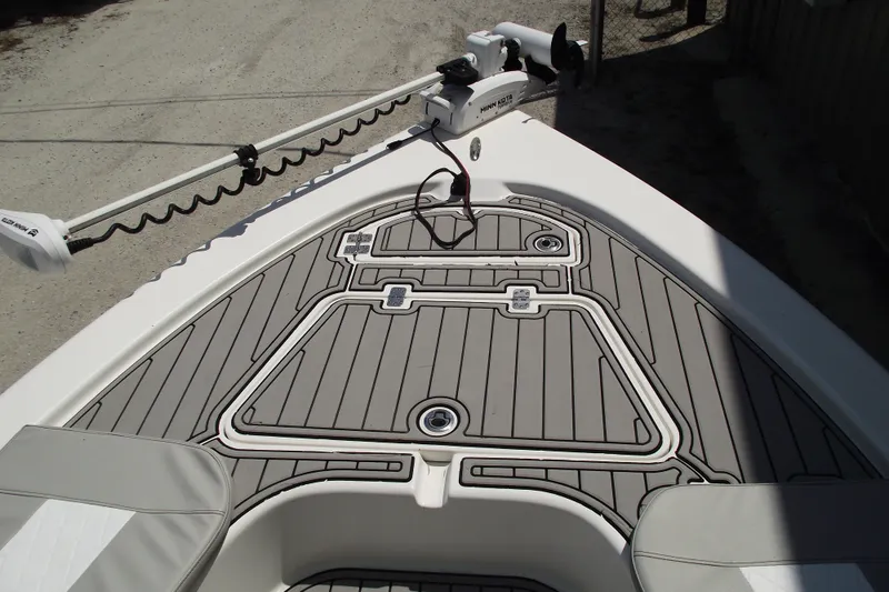 Slide: The Image of 2019 Sea Pro 208 Bay boat deck with trolling motor and sleek design. - 6