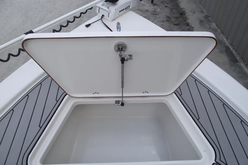 Slide: The Image of Open storage compartment on a 2019 Sea Pro 208 Bay boat deck. - 8