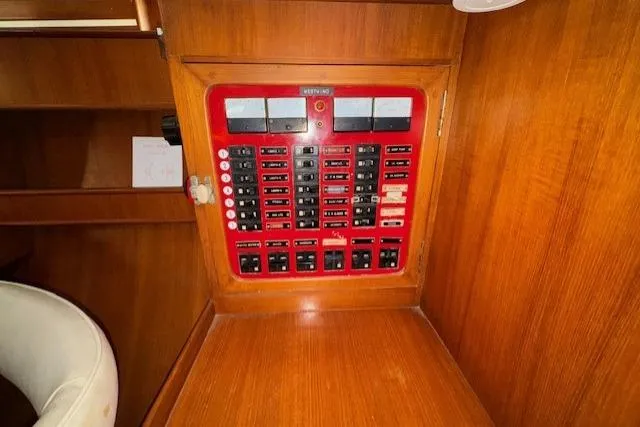 Slide: The Image of Interior of 1983 Tayana 55 yacht with wooden cabinetry and mounted TV. - 14