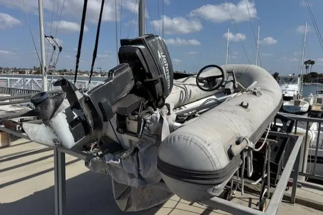 Slide: The Image of Engine room of a 1983 Tayana 55 sailboat with visible machinery and piping. - 35