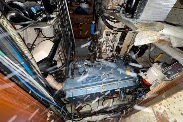 Slide: The Image of Engine room of 1983 Tayana 55 yacht with complex wiring and equipment. - 36