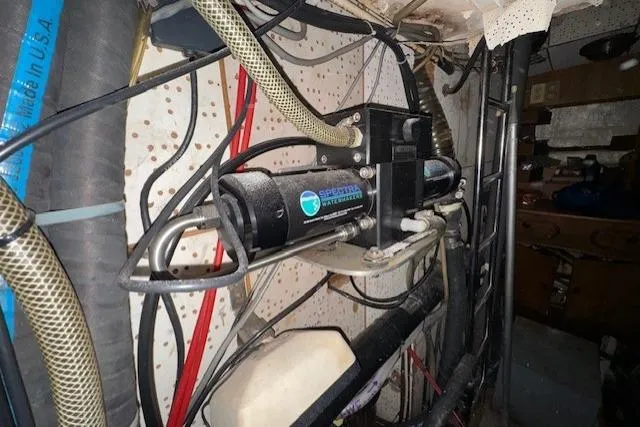 Slide: The Image of Storage area on 1983 Tayana 55 sailboat with ropes and yellow bags. - 38