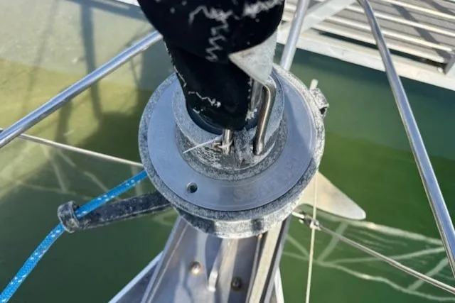 Slide: The Image of Tayana 55 sailboat deck with rigging and ropes, docked at marina, 1983 model. - 39