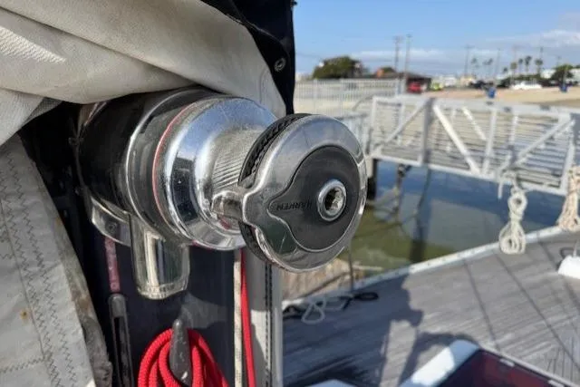 Slide: The Image of Inflatable boat with outboard motor on Tayana 55, 1983 model, docked at marina. - 42