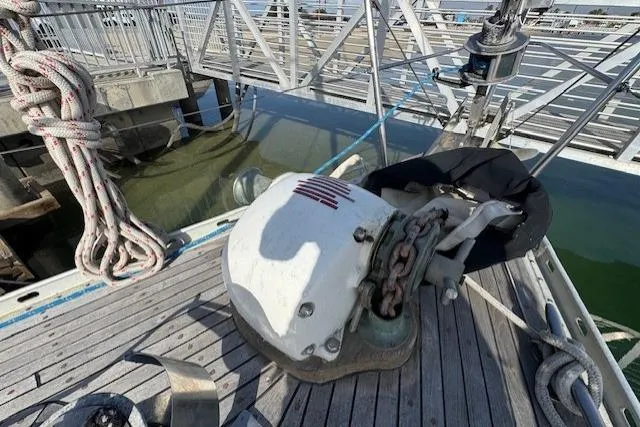 Slide: The Image of Winch and ropes on 1983 Tayana 55 sailboat deck, showcasing nautical equipment. - 8