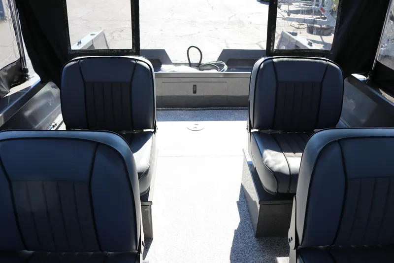 Slide: The Image of Interior of 2026 Alumaweld Talon 18 boat with four black seats. - 10
