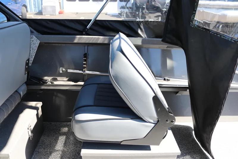 Slide: The Image of 2026 Alumaweld Talon 18 boat interior with gray seating and black accents. - 16