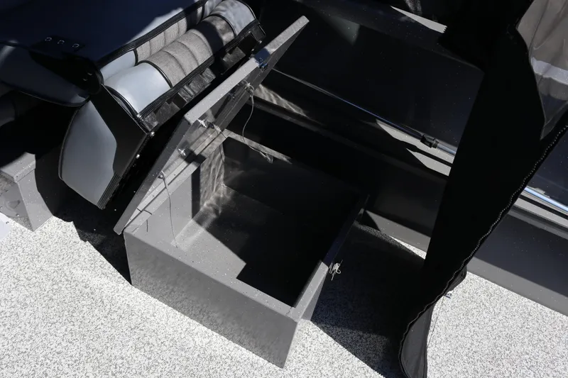 Slide: The Image of Open storage compartment in 2026 Alumaweld Talon 18 boat interior. - 18
