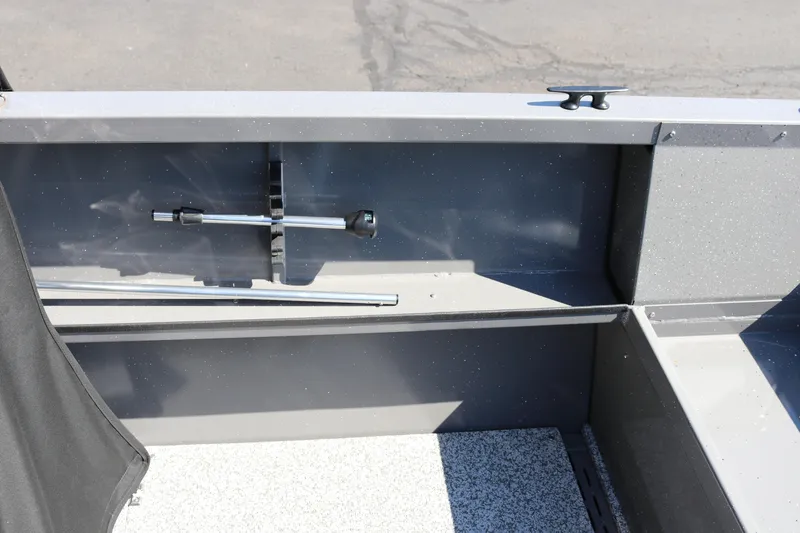 Slide: The Image of Interior view of 2026 Alumaweld Talon 18 boat, showcasing storage compartment and fittings. - 19