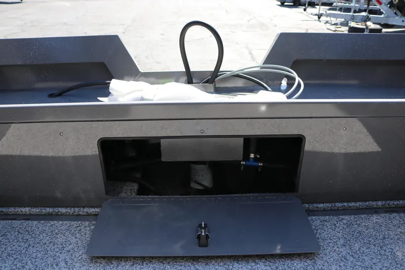 Slide: The Image of 2026 Alumaweld Talon 18 boat compartment with cables and open hatch. - 23