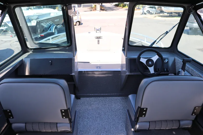 Slide: The Image of Interior view of 2026 Alumaweld Talon 18 boat, featuring dual seats and steering console. - 3