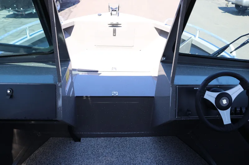 Slide: The Image of 2026 Alumaweld Talon 18 boat interior with steering wheel and dashboard view. - 4