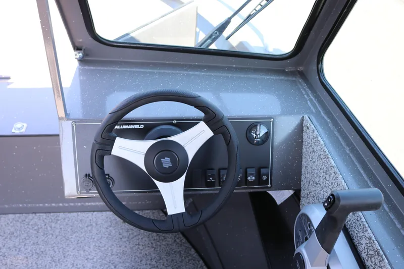 Slide: The Image of Steering console of 2026 Alumaweld Talon 18 boat with modern controls. - 5