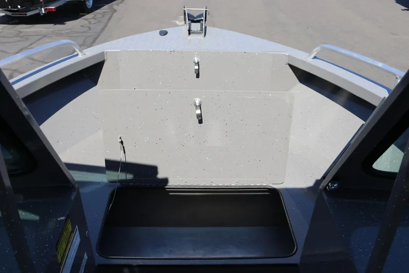 Slide: The Image of 2026 Alumaweld Talon 18 boat interior with storage compartment and sleek design. - 9