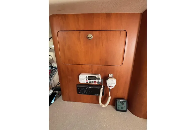 Slide: The Image of 2001 Intrepid 377 Walkaround cabin with radio equipment and digital thermometer. - 11