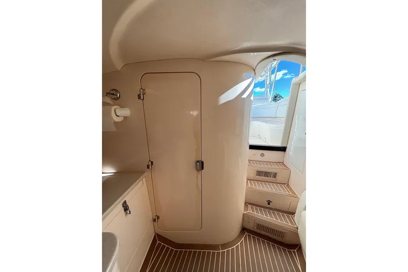 Slide: The Image of Interior of 2001 Intrepid 377 Walkaround boat, featuring cabin door and steps. - 25